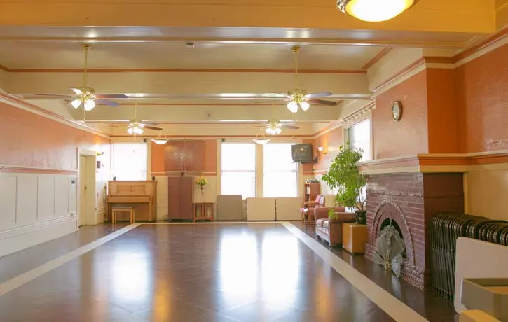 a large empty room with a fireplace in it