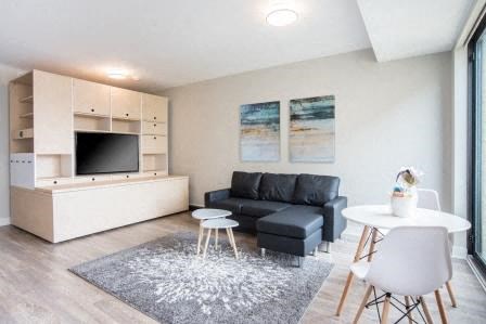 a living room with a couch and a table