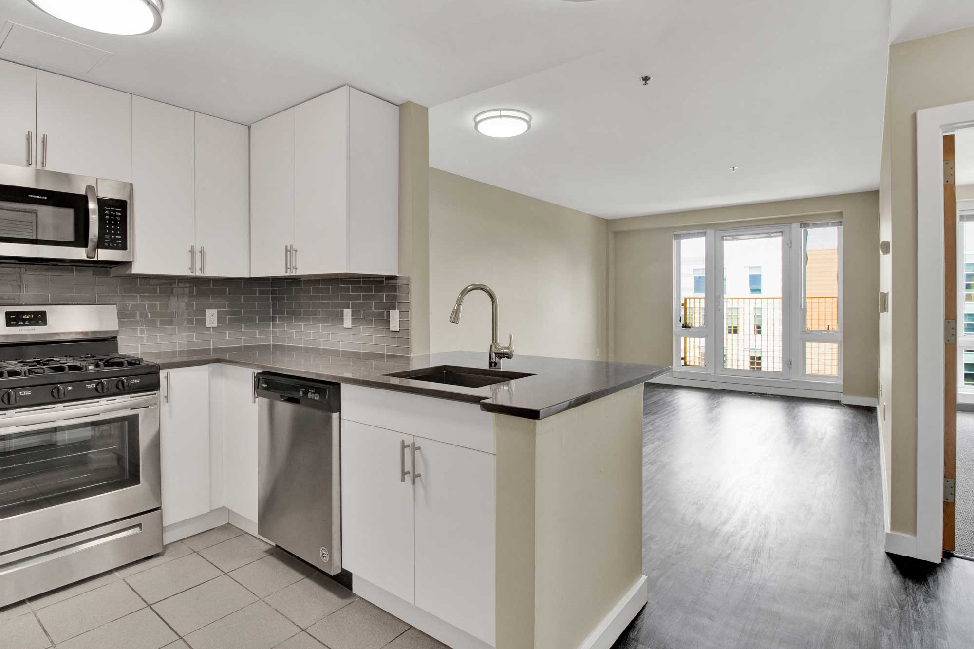 Open floor plan, modern kitchen, lots of light