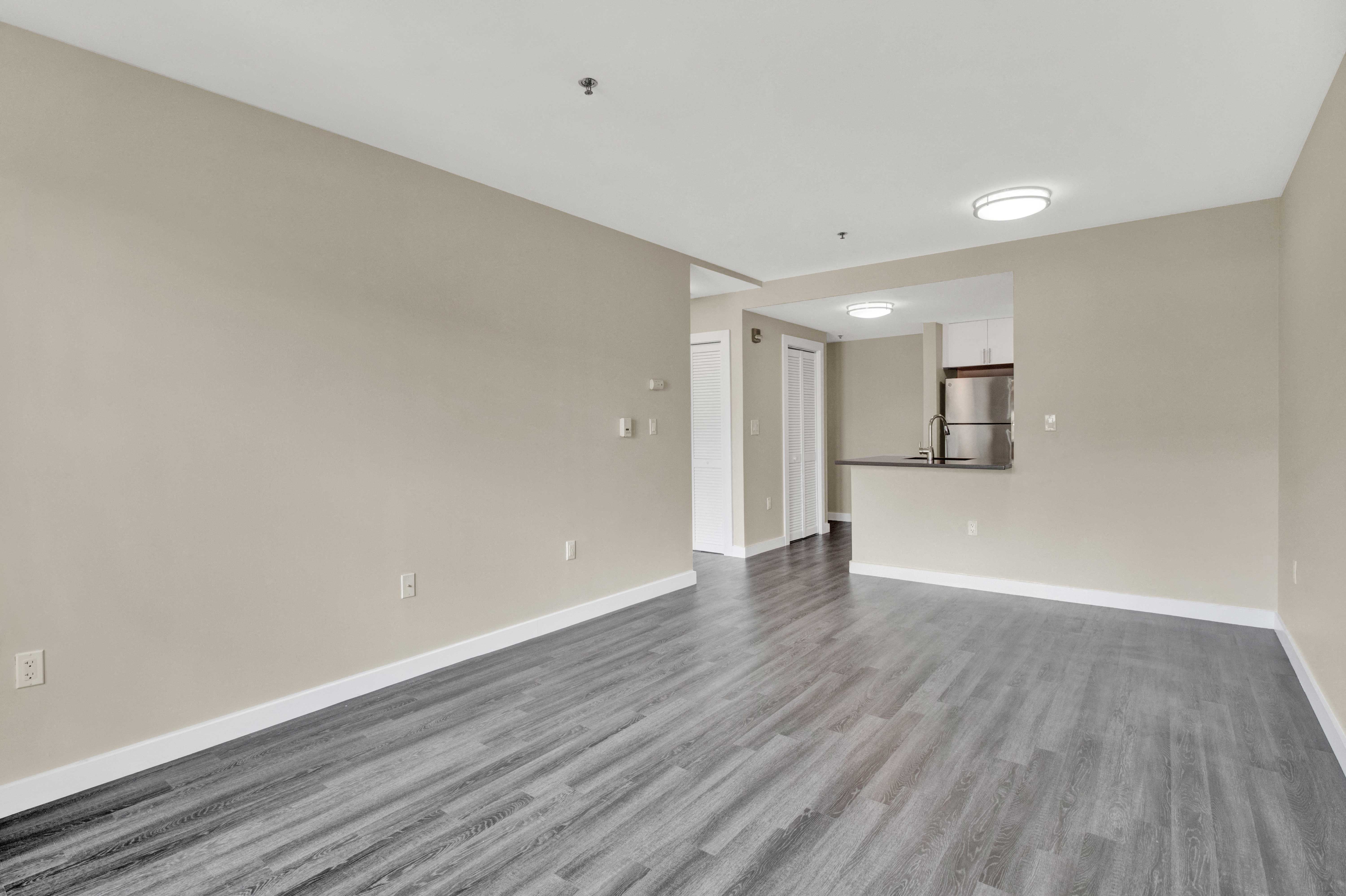 View of the living room looking back in towards the kitchen .