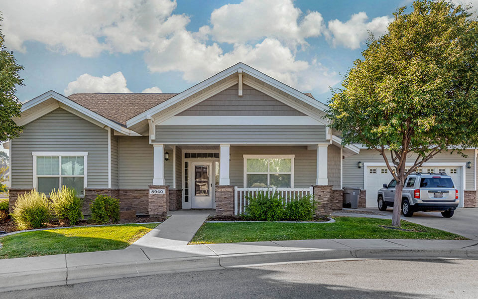 a house with a car parked in front of it