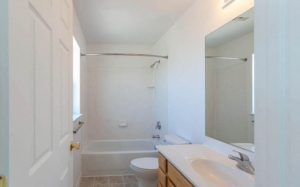 a bathroom with a sink toilet and a shower