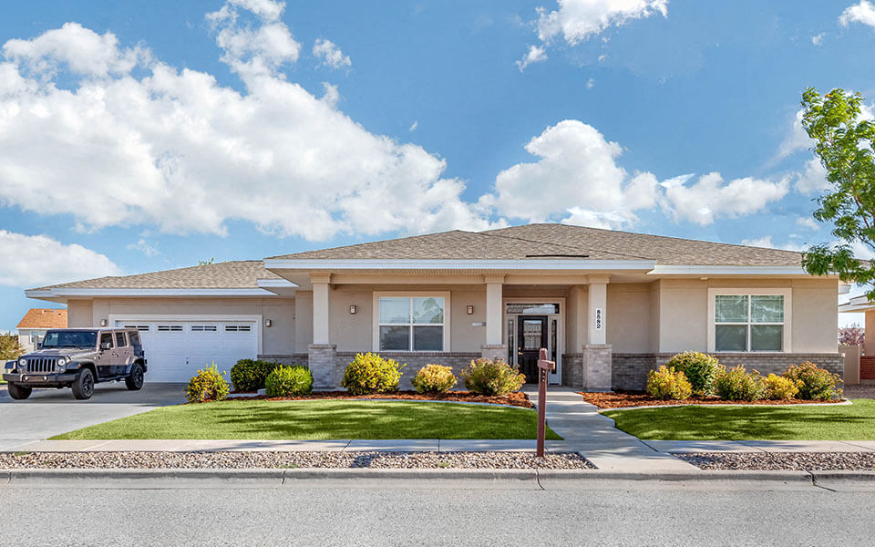 a house with a jeep parked in front of it