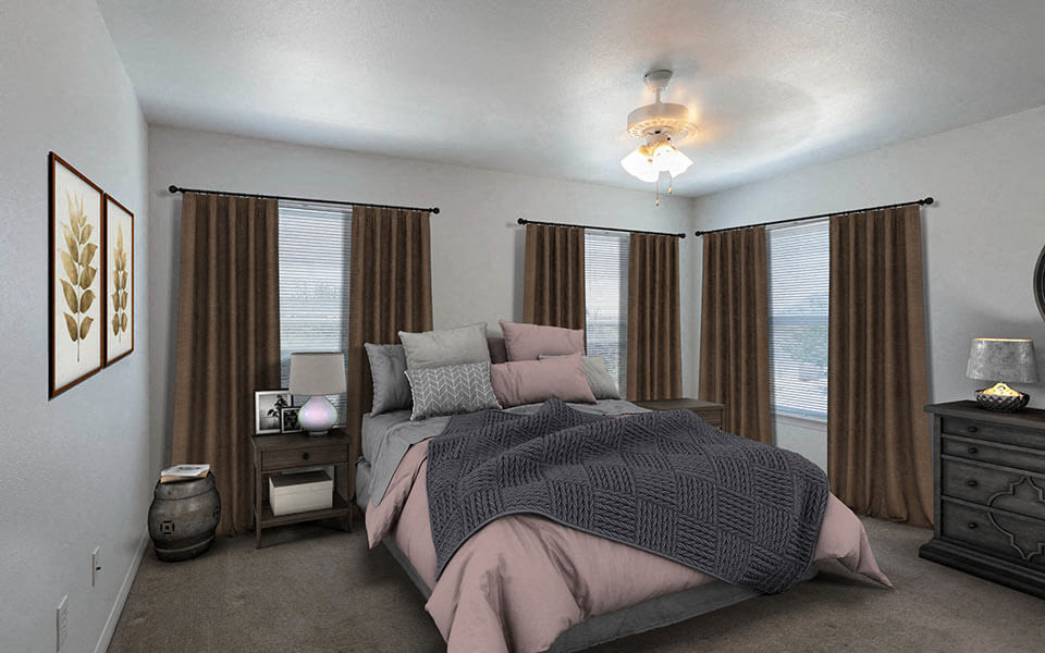 a bedroom with a bed and windows with brown curtains