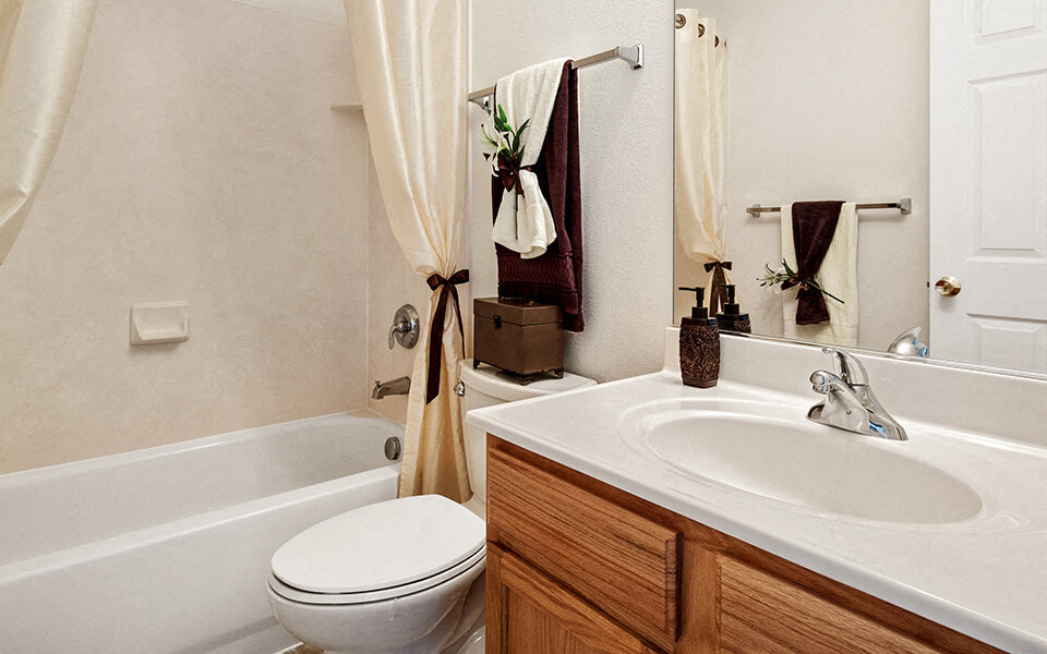 a bathroom with a sink toilet and a bath tub