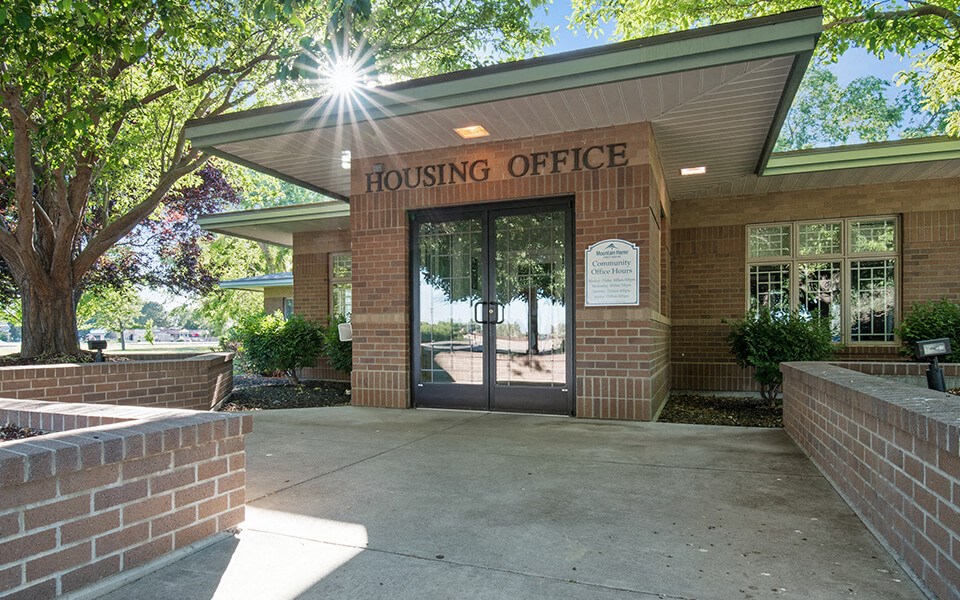 the entrance to the leasing office of the housing office building