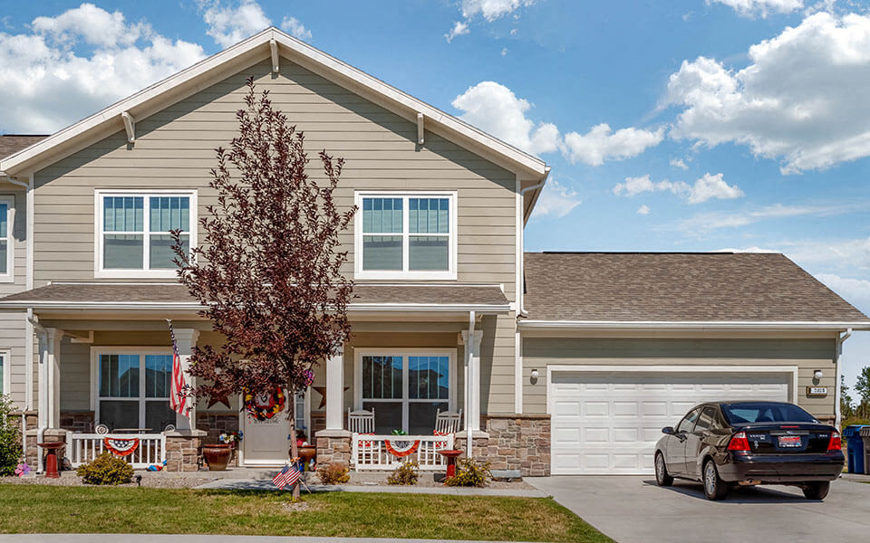 a house with a car parked in front of it