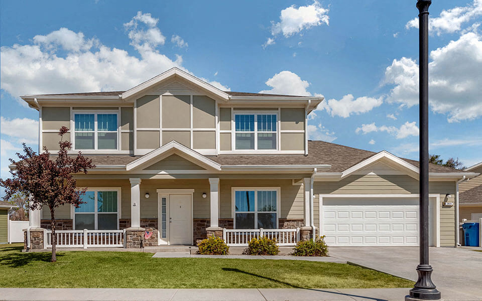a large house with a lawn in front of it