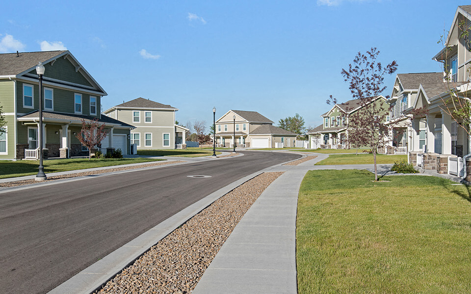 a street with houses on either side of a road