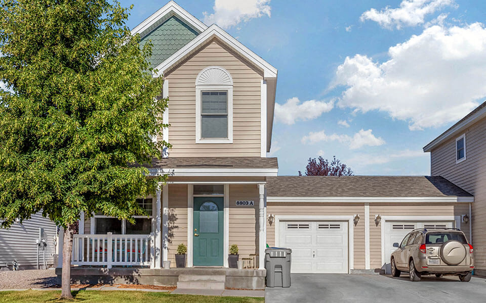 a house with a car parked in front of it