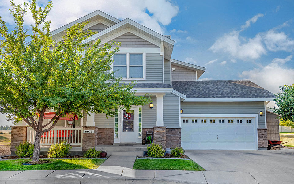 a house with a tree in front of it