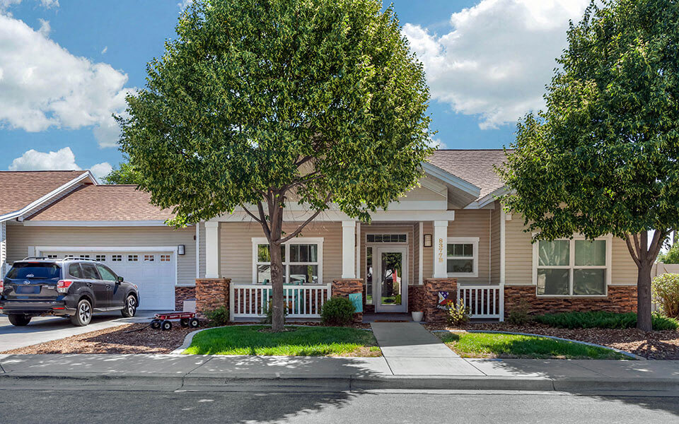 a house with a car parked in front of it