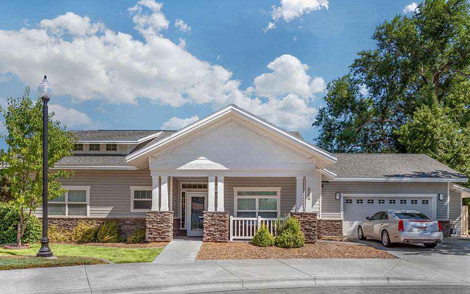 a house with a car parked in front of it