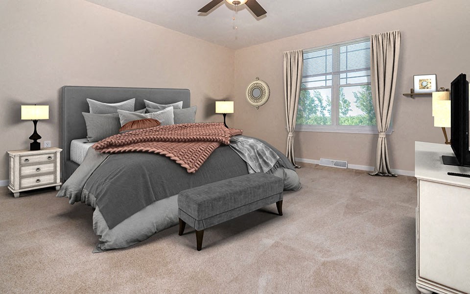 a bedroom with a bed and a tv