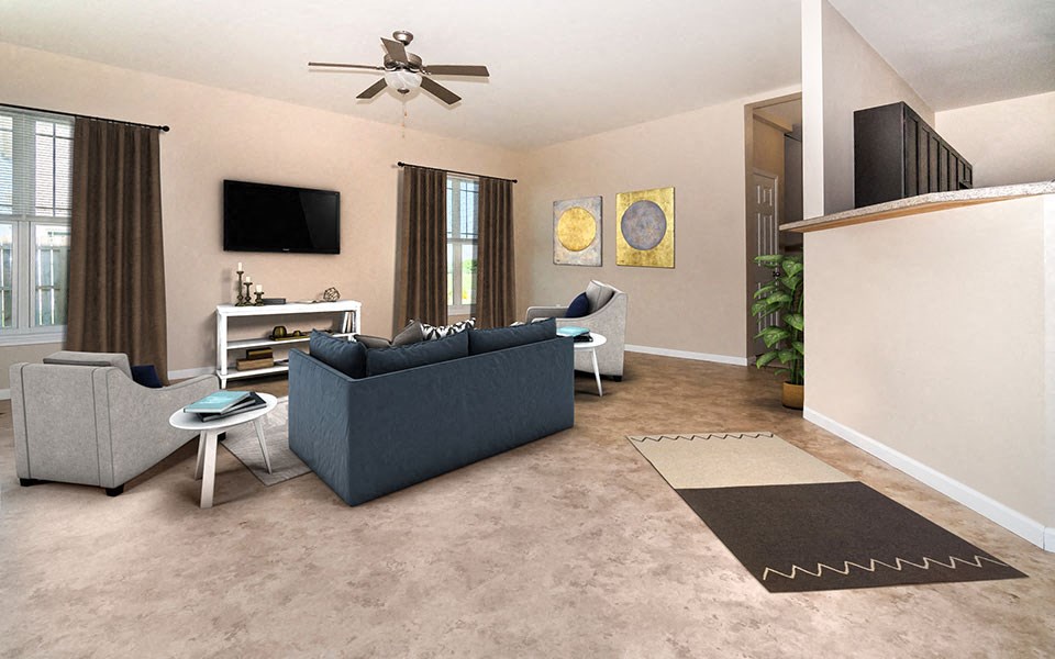 a living room with a blue couch and a ceiling fan