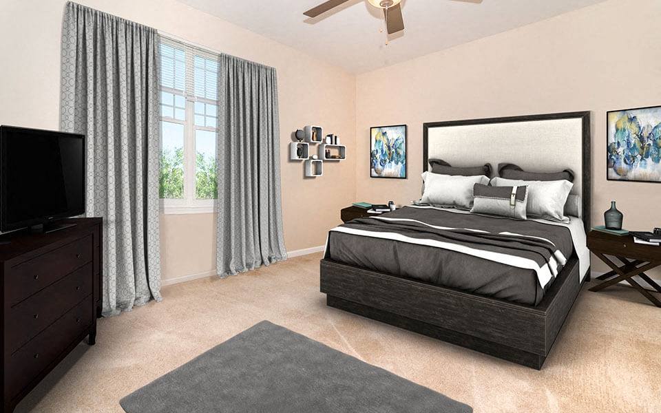 a bedroom with a bed and a tv