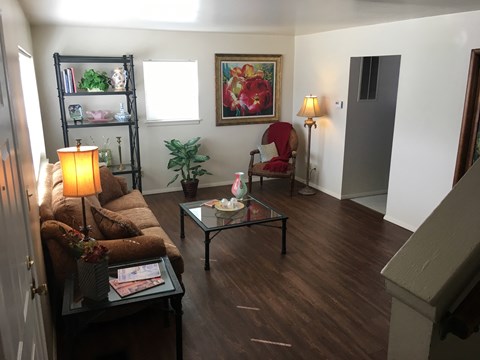a living room with a couch and a table