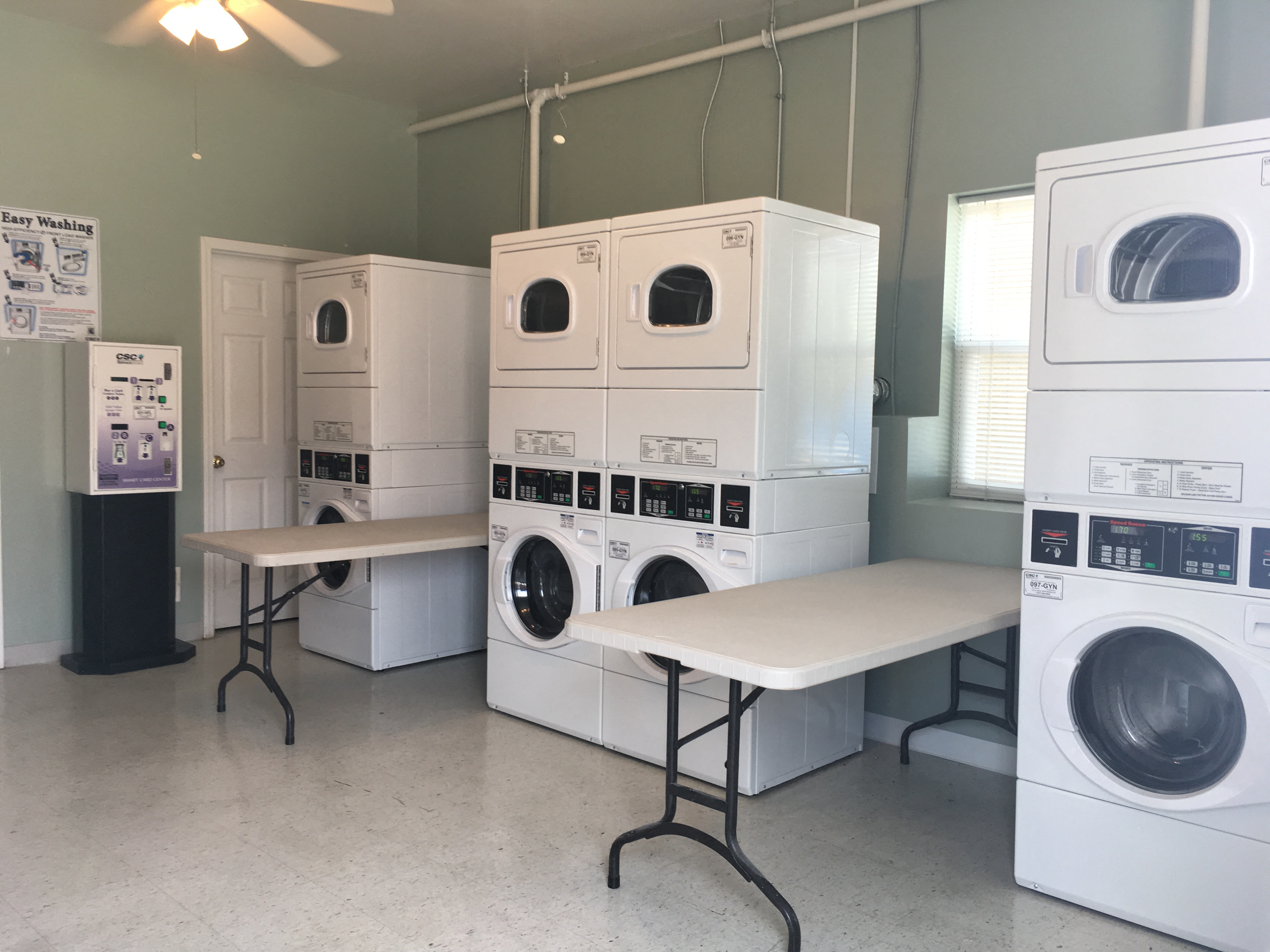 a laundry room with a bunch of washing machines
