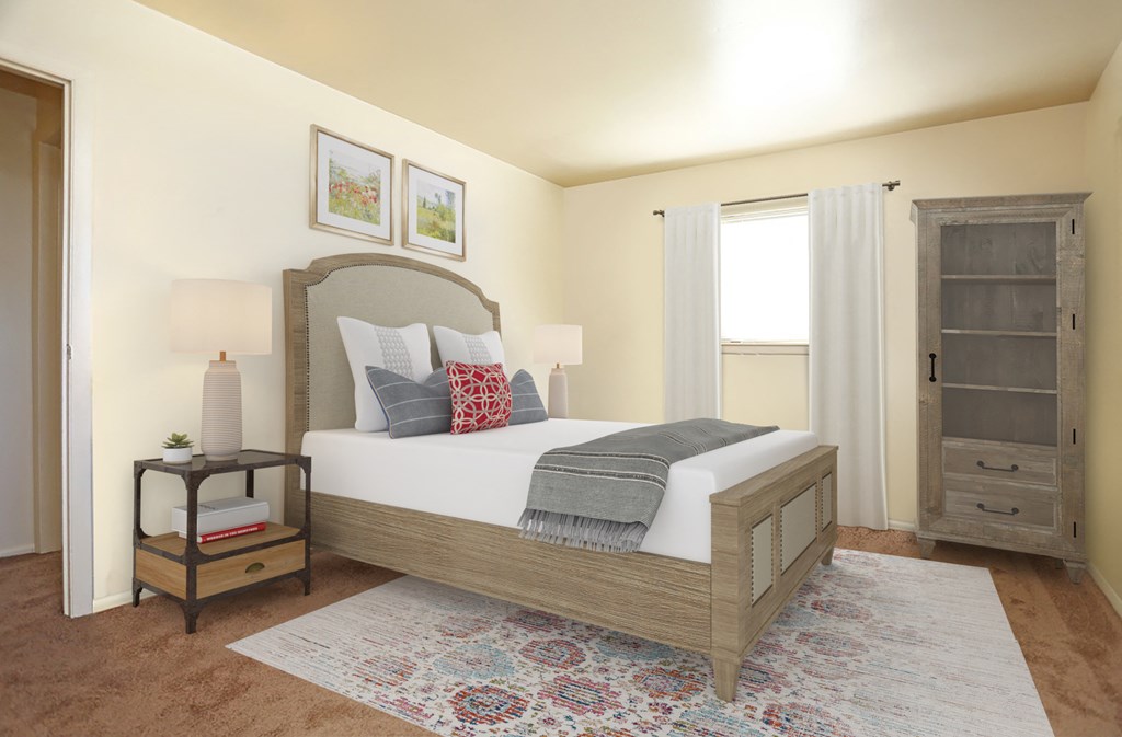 a bedroom with a bed and a dresser and a window