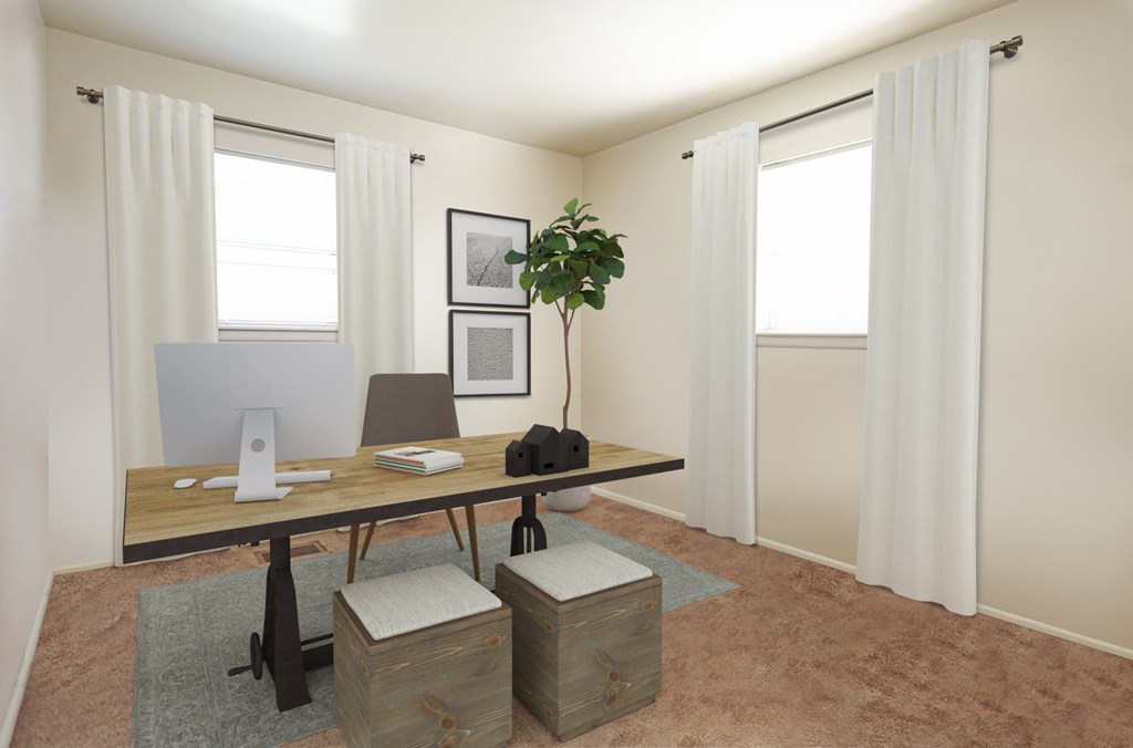 a home office with a desk and a computer