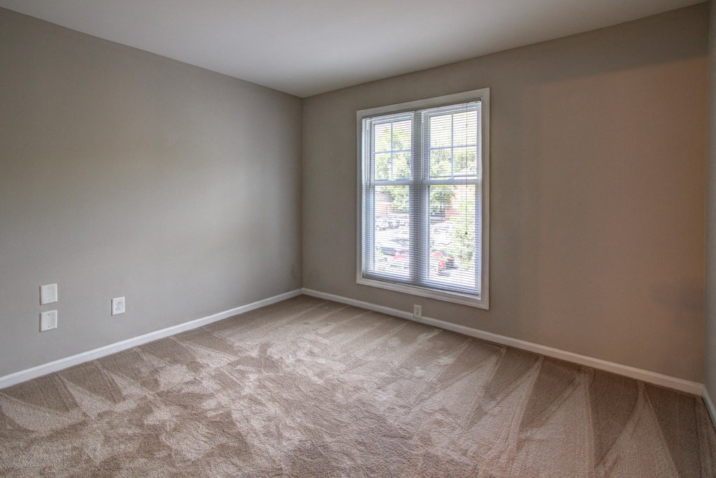 an empty room with a window in it