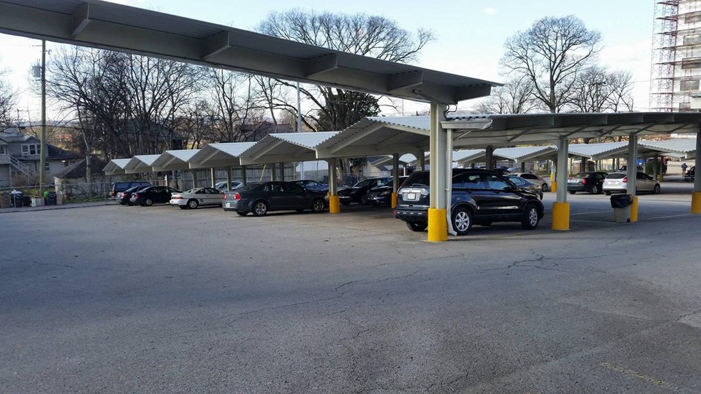 a row of cars parked at a gas station
