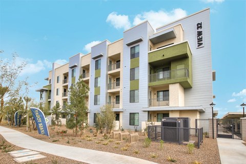 A modern apartment building with the name "ZEN" on the side.