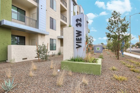 A building with the sign "VIEW 32" in front of it.