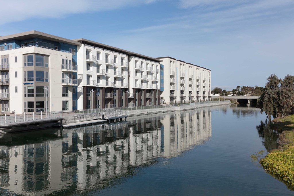 The Triton Foster City CA building water view