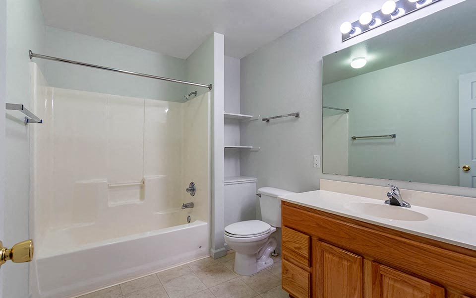 a bathroom with a sink toilet and a shower