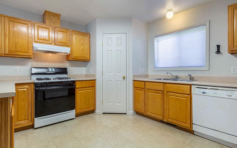 a kitchen with a stove and a sink