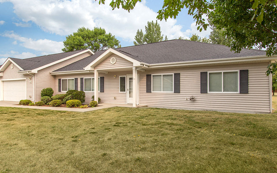 a house with a lawn in front of it
