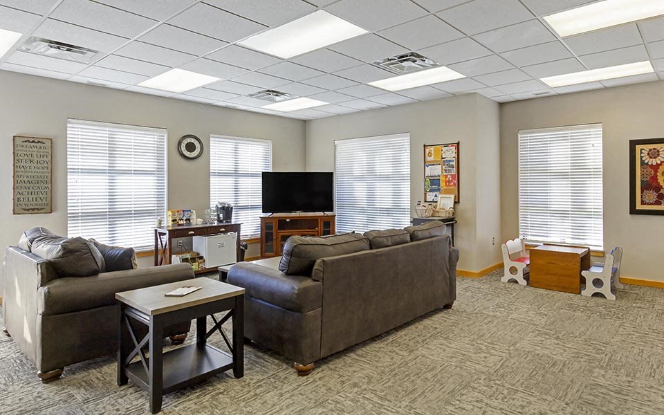 a living room with couches and a television
