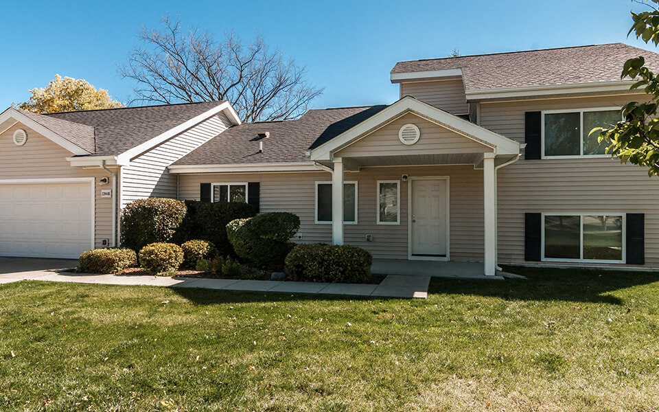 a house with a lawn in front of it