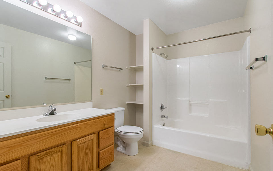a bathroom with a sink toilet and a shower