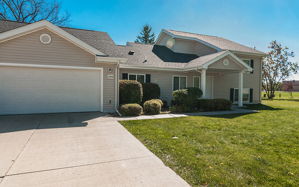 a house with a driveway and a garage door