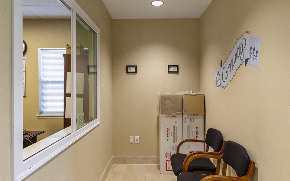 a room with a chair and a window