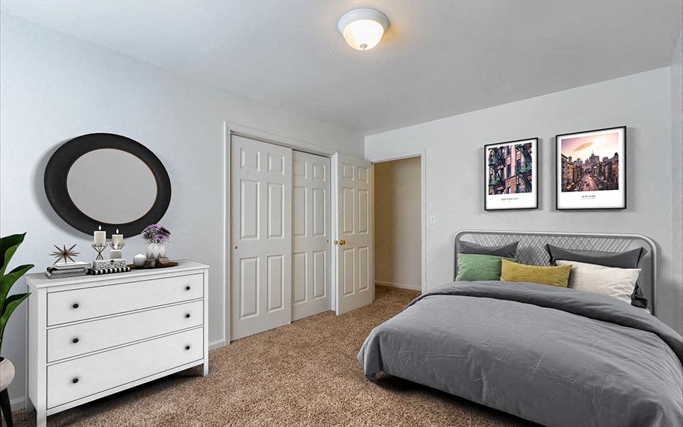 a bedroom with a bed and a dresser