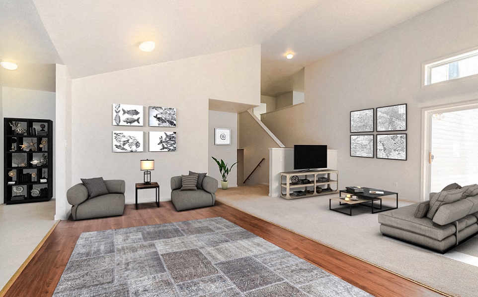 the living room of a house with couches and a tv