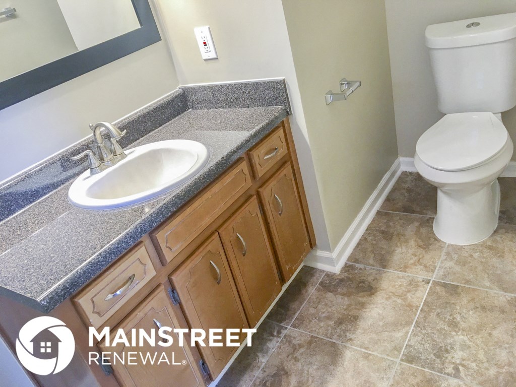 a bathroom with a sink and a toilet