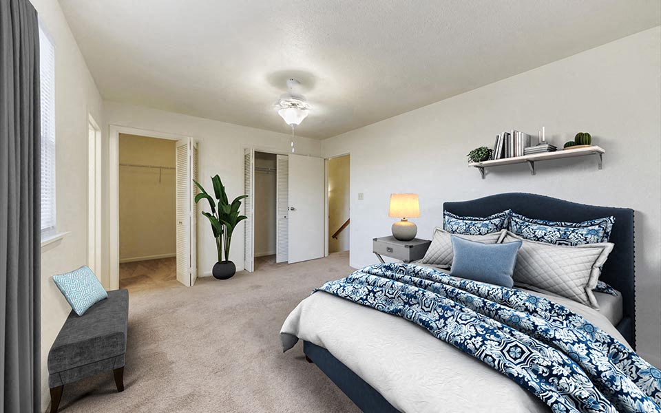 a bedroom with a bed and a closet