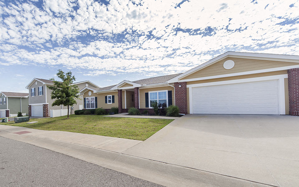 a house with a driveway and a white garage door