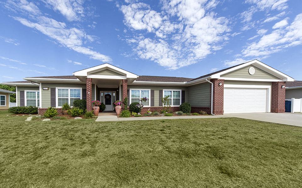 a house with a lawn in front of it