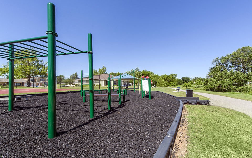 a park with a playground and a picnic table