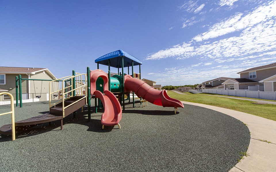 a playground with a slide and other play equipment