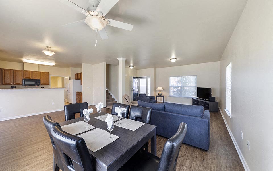 a living room with a table and a couch