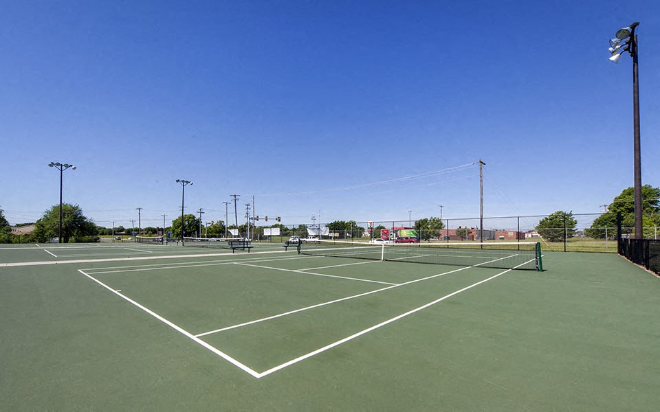 a tennis court with two people on it