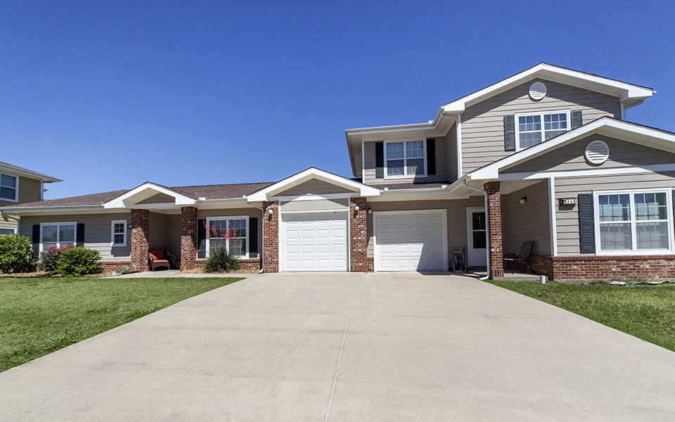 a large house with a driveway in front of it