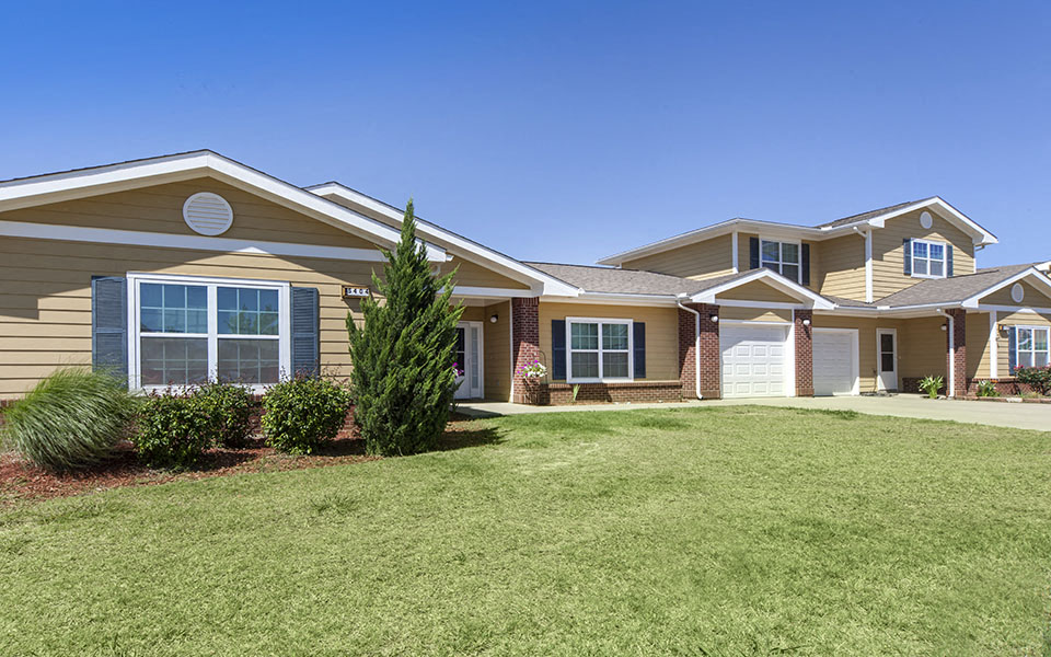a house with a lawn in front of it