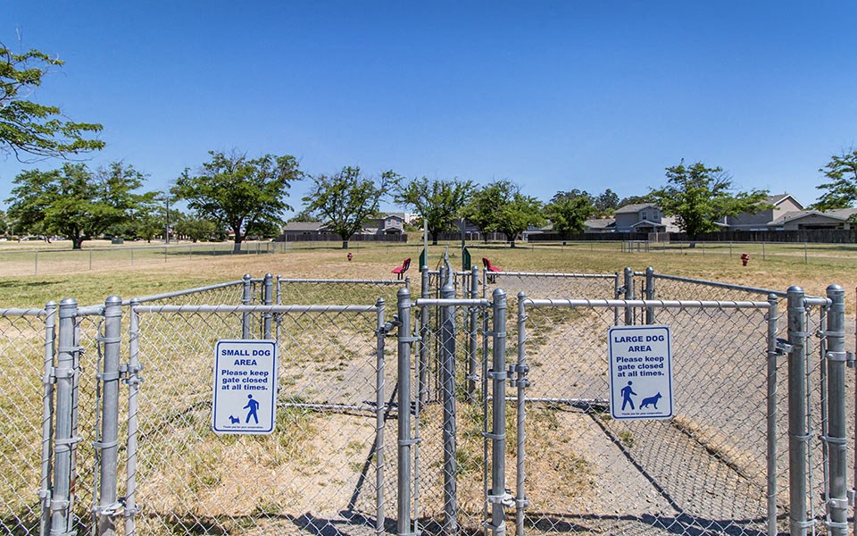 a chain link fence with signs on it